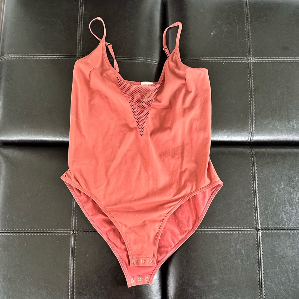 Pink body suit never worn